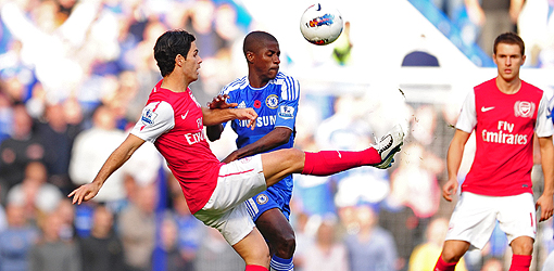 Chelsea's Ramires and Arsenal's Mikel Arteta (left) battle for the ball.
